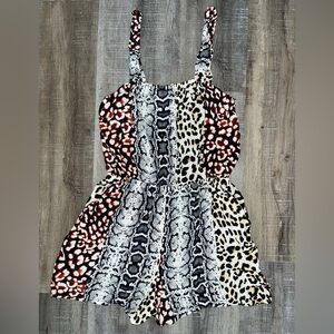 Animal Print Romper with ruffled straps and pockets. From Express. Size XS.